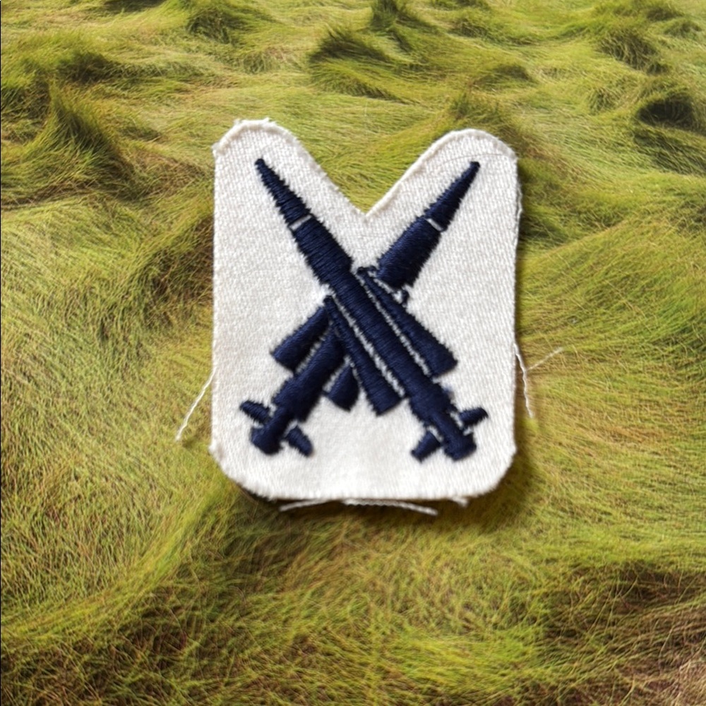 Vintage White Patch with Blue Rocket Design